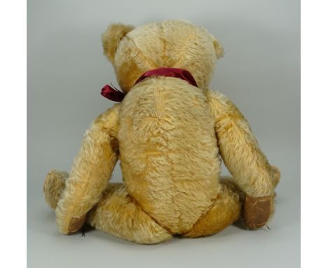 A large Chad Valley golden mohair Teddy bear, 1950s, the straw and kapok filled bear with large orange plastic eyes, stitched