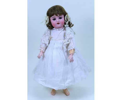 A Heinrich Handwerck/S&H bisque head girl doll, German circa 1905, with weighted blue glass eyes, raised eyebrows, open mouth