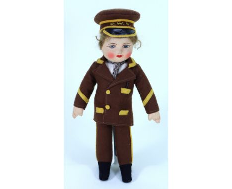 A Chad Valley cloth doll in G.W.R uniform, English 1930s, with painted features, short brown hair swivel head and stitched fi