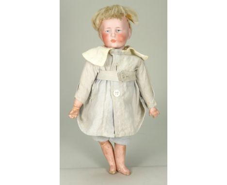 A Kammer & Reinhardt 101 character bisque head doll, German circa 1910, with painted blue eyes, single stroke brows and close