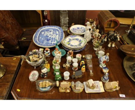 A large blue and white old willow patterned meat plate; various decorative ornaments to include Lilliput Lane model cottages;
