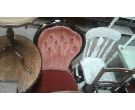 A late Victorian ebonised and button back nursing chair 