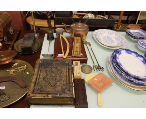 A Victorian leather bound Bible; two cribbage boards; a copper kettle; two toasting forks; a silver plated ladle etc.