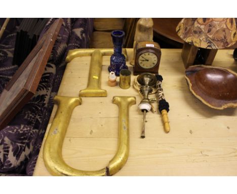Two gilded letters; a Turkish pipe; a mantel clock etc.
