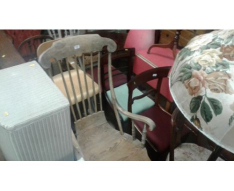 A continental pine stick back rocking chair 