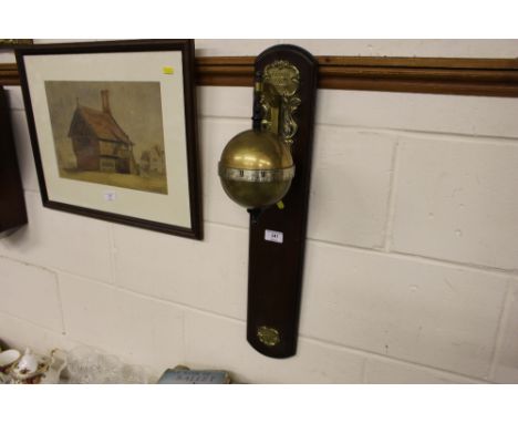 An unusual reproduction mahogany and brass globe clock 