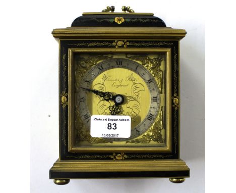 A Japanese style black lacquered and chinoiserie decorated mantel clock by Thwaites and Reed of England 