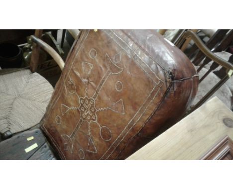 A pair of Edwardian mahogany chairs; a leather pouffe; and a 19th Century elm topped stool for restoration 