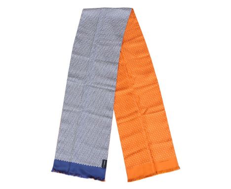 Hermès, a reversible silk scarf, one side orange with white polka dots, the reverse with a white geometric pattern to a blue 