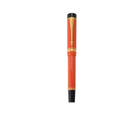 Parker, Duofold Centennial, an orange fountain pen, the cap with gilt arrow clip and double cap band, the fine nib stamped 18