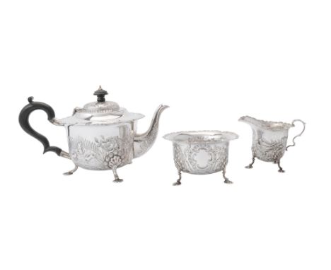 A silver shaped circular three piece tea service by S. Blanckensee &amp; Son Ltd, Birmingham 1918, the tea pot with an ebonis