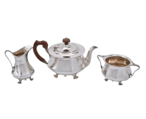 A Scottish silver circular three piece tea service by James Weir, Glasgow 1921, Rd. No. 398113, in Arts and Crafts taste, the