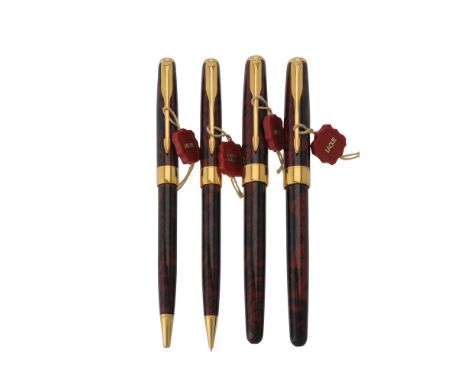Parker, Sonnet A, a red laque marbled fountain pen, roller ball pen, ball point pen and propelling pencil, the fountain pen c