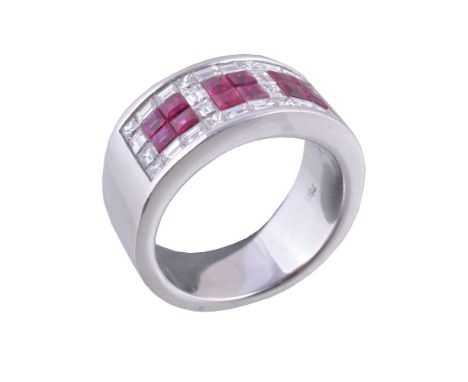 A ruby and diamond ring, set with panels of square cut rubies, approximately 1.20 carats total, within a surround of baguette