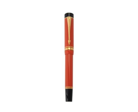 Parker, Duofold Centennial, an orange fountain pen, the cap with gilt arrow clip and double cap band, the fine nib stamped 18