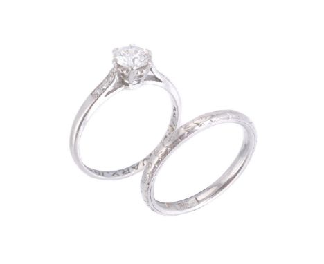 A diamond single stone ring, the brilliant cut diamond, estimated to weigh 0.55 carats, with three eight cut diamonds to each