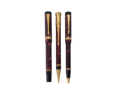 Parker, Duofold International, a red marbled fountain pen, ball point pen and propelling pencil, the fountain pen cap with gi