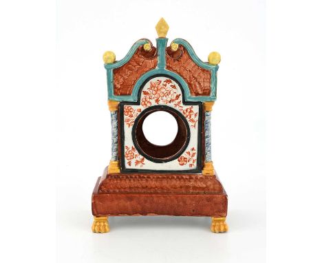 A Staffordshire sponge decorated pearlware watch holder, modelled as a squat longcase clock, on lions paw feet, open swan nec