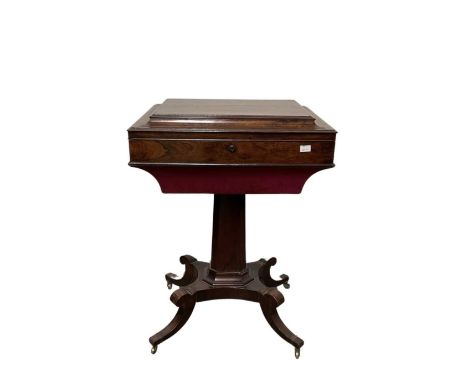 A Regency rosewood work table, c.1820, hinged caddy top opening to a fitted velvet lined interior, tapered octagonal pedestal