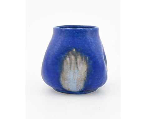 Ruskin Pottery, a Crystalline vase, 1927, dimpled squat baluster form, matte blue with patches of pale over taupe, impressed 