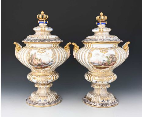 A large pair of Meissen style Dresden vases and covers, twin handled double ogee urn form with mask handles, painted with Kau