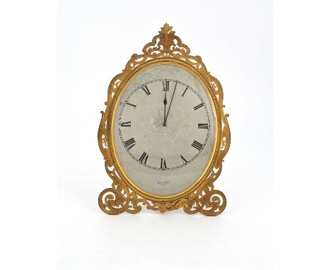 London &amp; Ryder, 17 New Bond St, London, a late 19th Century gilt metal easel desk timepiece, oval with bright cut scroll 