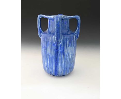 Ruskin Pottery, a Crystalline four handled vase, 1931, shouldered cylindrical form, various shades of marbled and streaky blu