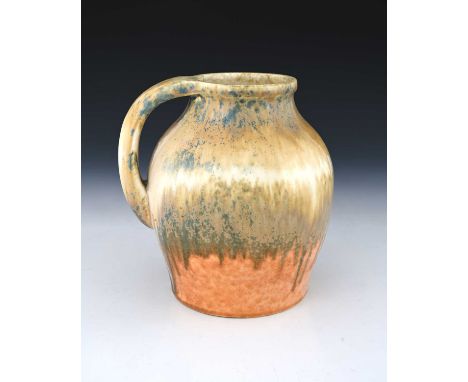 Ruskin Pottery, a Crystalline jug, 1933, shouldered ovoid form with strap handle, banded taupe over orange with blue crystal 