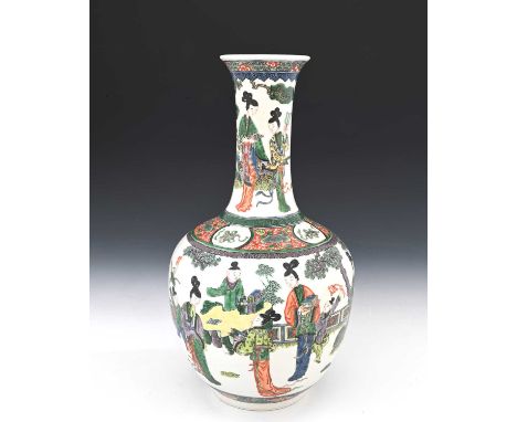 A Chinese famille verte vase, ovoid form with flared neck, painted in the round with courtly figures and boys playing in a ga