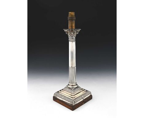 A Victorian silver Corinthian column lamp base, atop a wood base, Hawksworth, Eyre &amp; Co Ltd, Sheffield 1896, height 39.5c