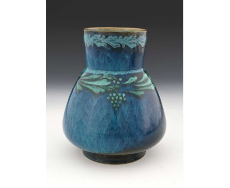 Ruskin Pottery, an early vine painted Souffle glazed vase, circa 1900, conical baluster form with cylindrical neck, green sea