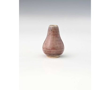 Ruskin Pottery, a miniature High Fired vase, circa 1920, conical gourd form, liver coloured sang de boeuf with impressed mark