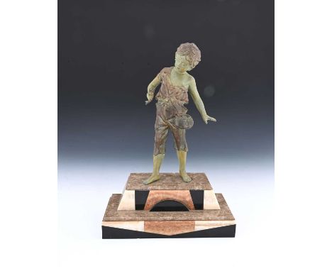 An Art Deco patinated art metal figure of a boy fishing, circa 1930, verdigris and bronzed, on a stepped marble and onyx base