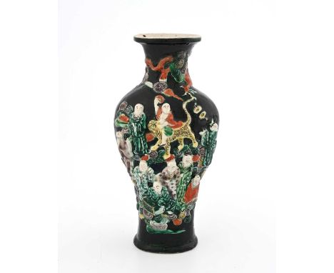 A Chinese Famille Noir relief moulded figural vase, incised Kangxi vase, possibly of the period, flattened inverse baluster f