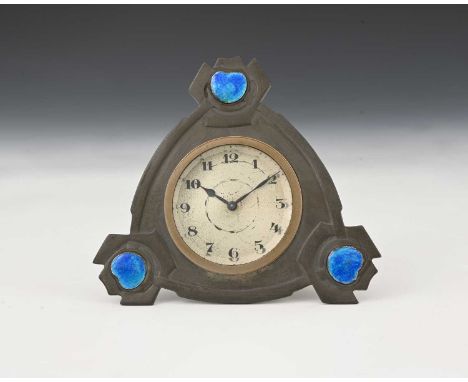 Archibald Knox for Liberty and Co., a Tudric Art and Crafts pewter and enamel clock, model 01296, tricorn plaque form with kn