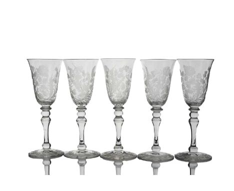 A set of five Edwardian Stourbridge etched glass flutes or wine glasses, each bell shamed bowl cut with clover, rose and this