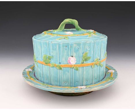 A George Jones majolica cheese dome and cover, relief moulded planked fence design with bramble entwined straps, and branch h