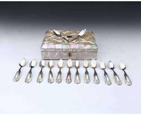 A nineteenth-century mother-of-pearl casket containing tea equipage, the hinged cover opens to reveal a fitted interior housi