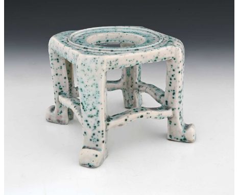 Ruskin Pottery, a High Fired stand, circa 1920s, in the Chinese style, square section bracketed cabriole legs, white with spe