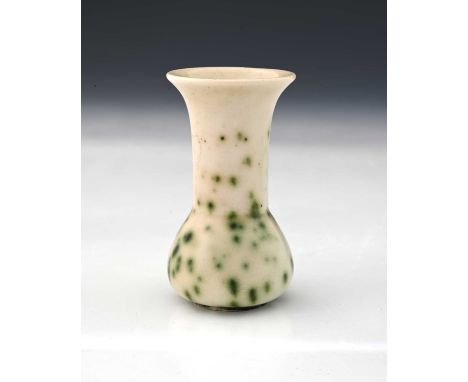 Ruskin Pottery, a small High Fired vase, circa 1920s, conical bulbous form with cylindrical flared neck, white with green oxi