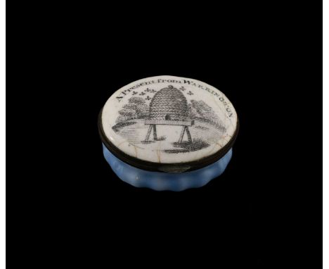 A Bilston enamel patch box, circa 1790, oval form with lobed foot, the lid decorated with a beehive and inscribed A Present f