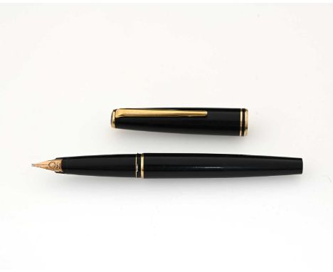 Montblanc, a Classic fountain pen, circa 1980, black resin with gold trim, 14 carat gold nib, 13.7cm long