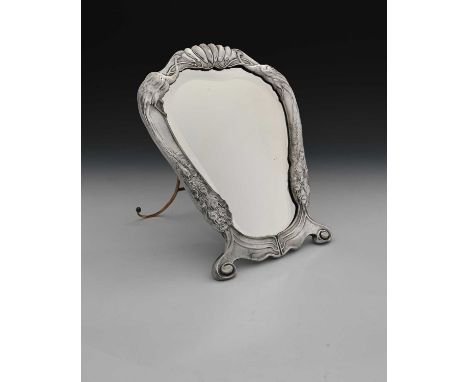 Osiris, a Jugendstil pewter easel back mirror, model 521, shield form, ogee shield form, cast in relief with peacocks flankin