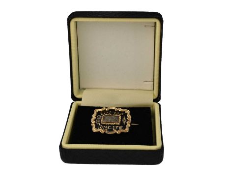 A Georgian yellow metal black enamel mourning locket, with hairwork inlay, reverse engraved 'M. Bruce, Obt, 30 Nov. 1834', le