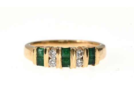 A 14ct gold emerald and brilliant-cut diamond dress ring, estimated total diamond weight 0.15ct, band stamped 14K, ring size 