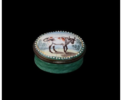 A Bilston enamel patch box, circa 1790, oval form, painted with a short horned cow, within jewelled border, green ground, 4.5