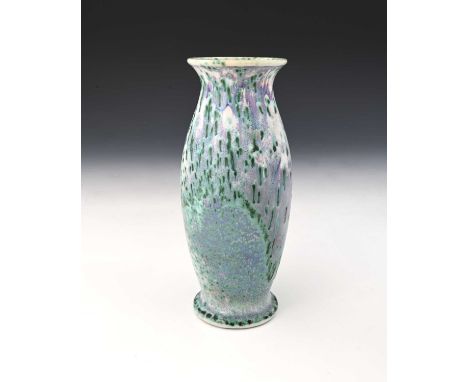 Ruskin Pottery, a High Fired vase, circa 1910, footed barrel form with everted rim, mottled and speckled green oxide over whi