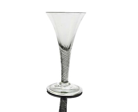 A large air twist wine glass or goblet, circa 1755, the flared trumpet bowl on a multi-strand open spiral twist stem and fold