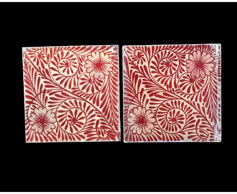 William De Morgan, a pair of foliate ruby lustre tiles, Chelsea, circa 1880, with two flowers to each, probably on Wedgwood o