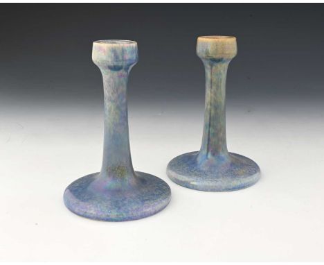 Ruskin Pottery, a pair of lavender Lustre candlesticks, 1925, splayed form with poppy head sconces, impressed marks, 17cm hig